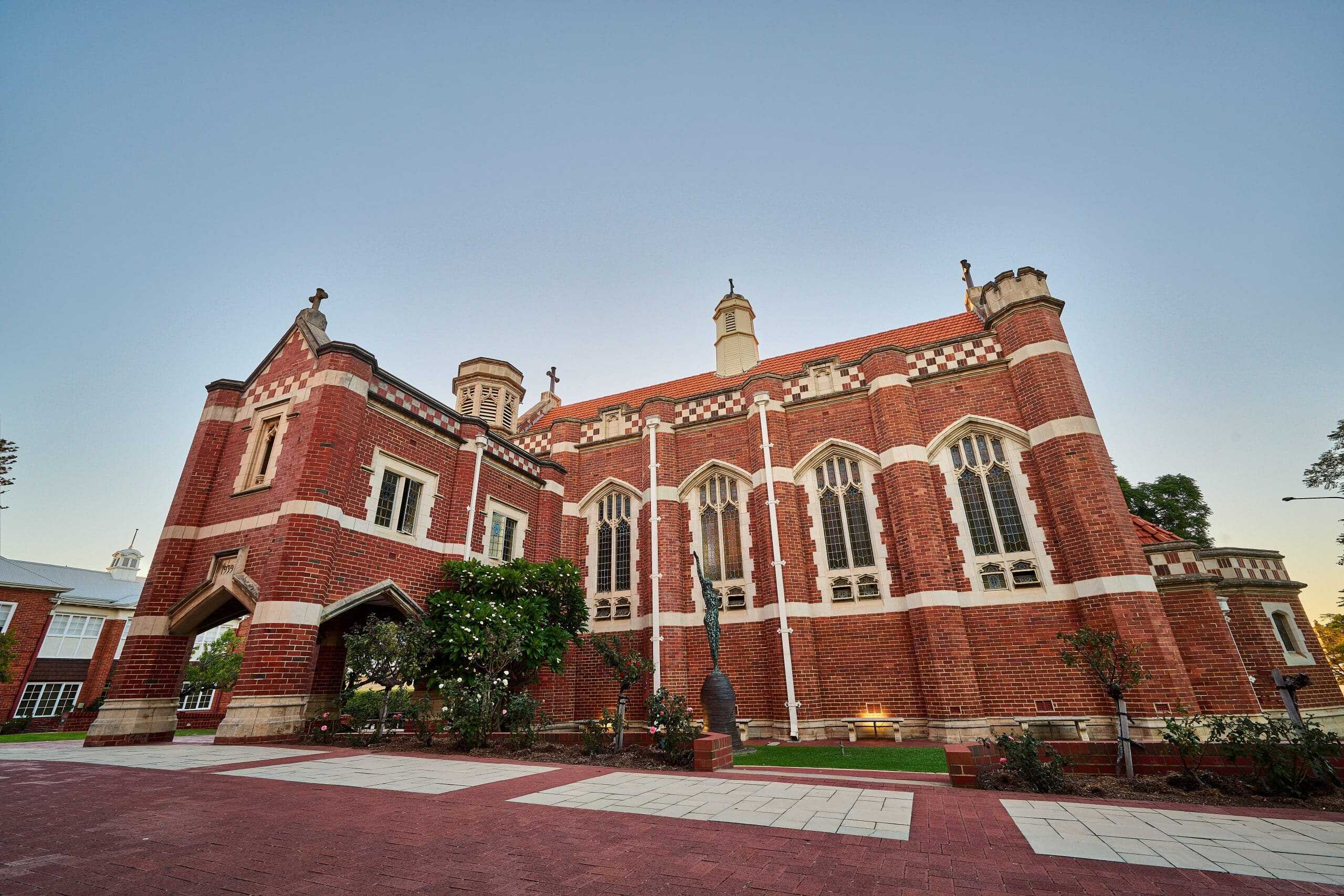 Historic red-brick building with arched windows